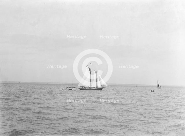 The 21-ton schooner 'Diablesse' leaving Cowes for America, 1922.  Creator: Kirk & Sons of Cowes.