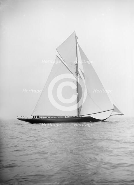 The 221 ton gaff-rigged cutter 'Britannia' sailing under spinnaker 1913. Creator: Kirk & Sons of Cowes.