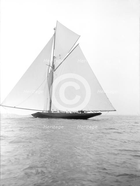 The 221 ton gaff-rigged cutter 'Britannia' sailing under spinnaker, 1913. Creator: Kirk & Sons of Cowes.