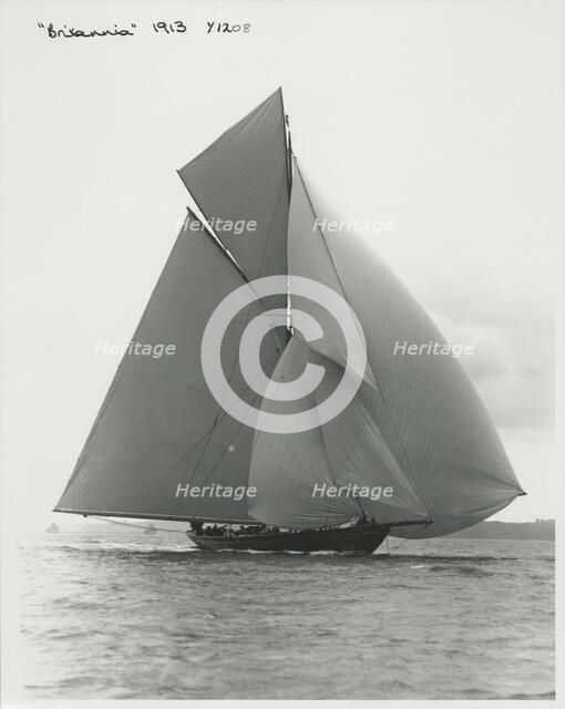 The 221 ton gaff-rigged cutter 'Britannia' sailing under spinnaker, 1913. Creator: Kirk & Sons of Cowes.
