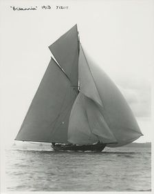 The 221 ton gaff-rigged cutter Britannia sailing under spinnaker, 1913. Creator: Kirk & Sons of Cowes
