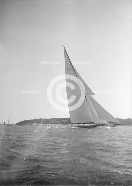 The 23-metre cutter 'Astra' sailing close-hauled, 1934. Creator: Kirk & Sons of Cowes.