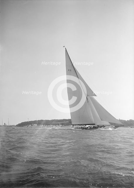 The 23-metre cutter 'Astra' sailing close-hauled, 1934. Creator: Kirk & Sons of Cowes.