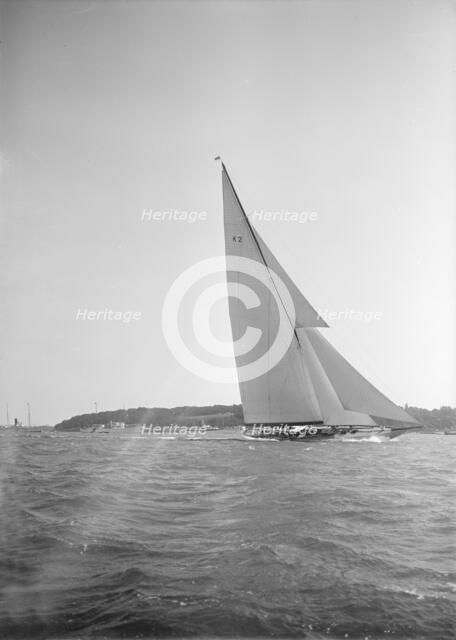 The 23-metre cutter 'Astra' sailing close-hauled, 1934. Creator: Kirk & Sons of Cowes.