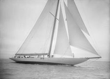 The 23-metre cutter Astra sailing close-hauled, 1935. Creator: Kirk & Sons of Cowes