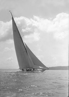 The 23-metre cutter Astra sailing close-hauled, 1931. Creator: Kirk & Sons of Cowes