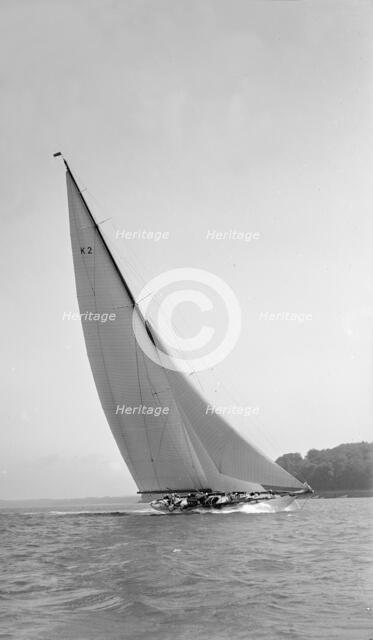 The 23-metre cutter 'Astra' sailing close-hauled, 1931. Creator: Kirk & Sons of Cowes.