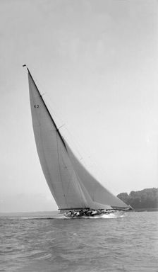 The 23-metre cutter Astra sailing close-hauled, 1931. Creator: Kirk & Sons of Cowes
