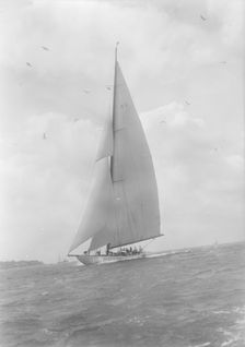 The 23-metre cutter Astra sailing close-hauled, 1933. Creator: Kirk & Sons of Cowes