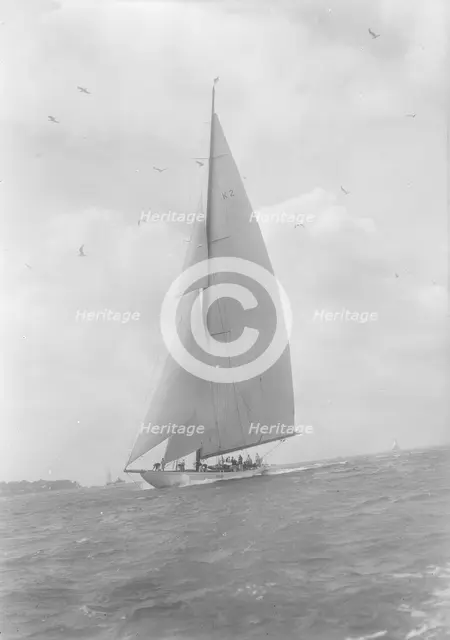 The 23-metre cutter 'Astra' sailing close-hauled, 1933. Creator: Kirk & Sons of Cowes.