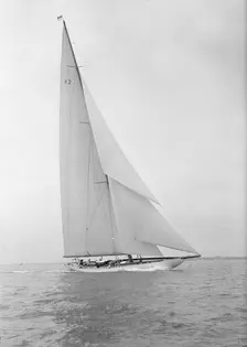 The 23-metre cutter Astra sailing close-hauled, 1933. Creator: Kirk & Sons of Cowes