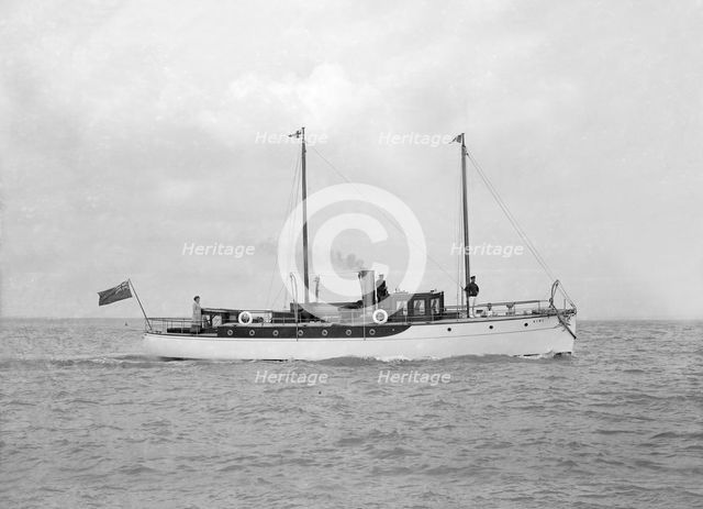 The 23 ton motor yacht 'Kiwi' under way, 1914. Creator: Kirk & Sons of Cowes.