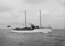 The 23 ton motor yacht Kiwi under way, 1914. Creator: Kirk & Sons of Cowes