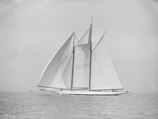 The 380 ton A Class schooner Margherita sailing under spinnaker, 1913. Creator: Kirk & Sons of Cowes