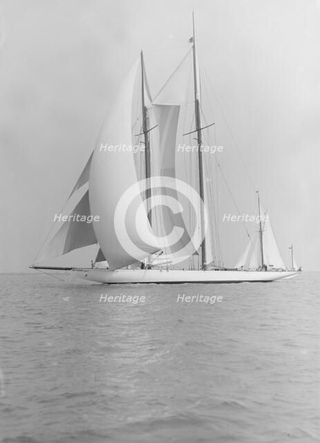 The 380 ton A Class schooner 'Margherita' sailing under spinnaker, 1913. Creator: Kirk & Sons of Cowes.