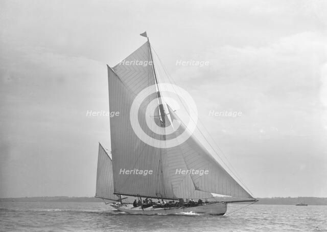 The 30 ton yawl 'Palmosa' under sail, 1911. Creator: Kirk & Sons of Cowes.