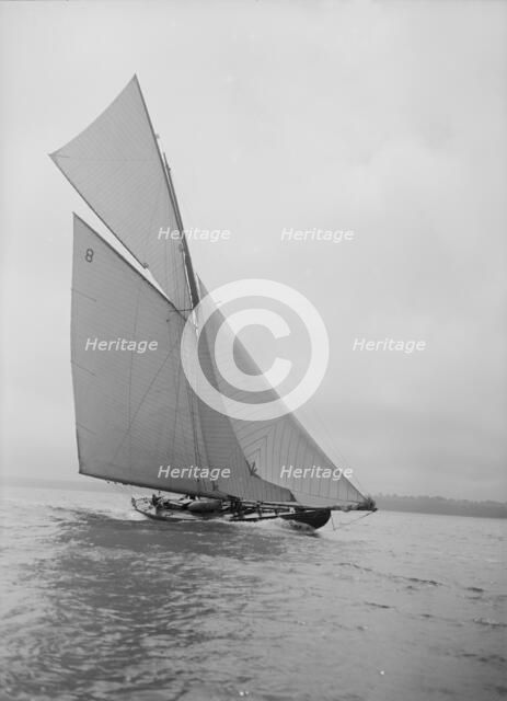 The 45 ton cutter 'Camellia' sailing close-hauled, 1911. Creator: Kirk & Sons of Cowes.