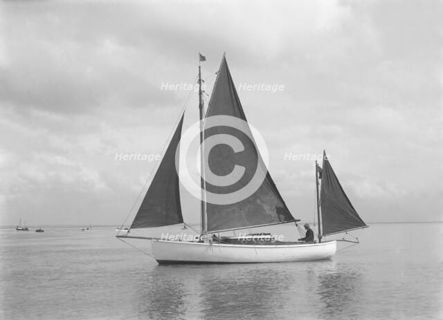 The 4 ton yawl 'Mandy' under sail, 1922. Creator: Kirk & Sons of Cowes.
