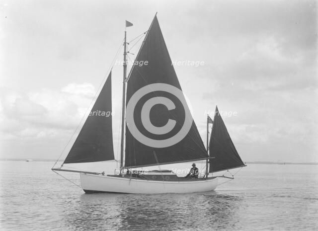 The 4 ton yawl 'Mandy' under sail, 1922. Creator: Kirk & Sons of Cowes.
