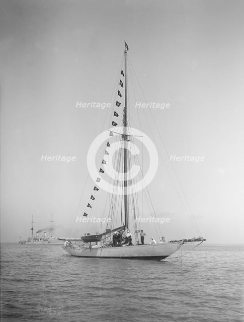 The 40-rater cutter 'Carina' at anchor with flags, 1911. Creator: Kirk & Sons of Cowes.