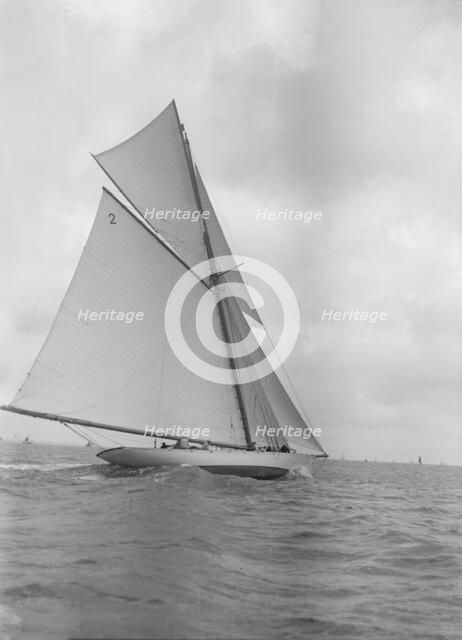 The 40-rater cutter 'Carina' sailing close-hauled, 1911. Creator: Kirk & Sons of Cowes.