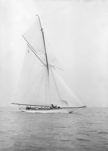 The 40-rater cutter Carina sailing close-hauled, 1913. Creator: Kirk & Sons of Cowes