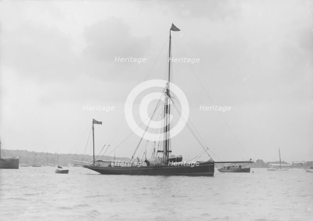 The 40 ton yawl 'Hyacinth' at anchor, 1913. Creator: Kirk & Sons of Cowes.