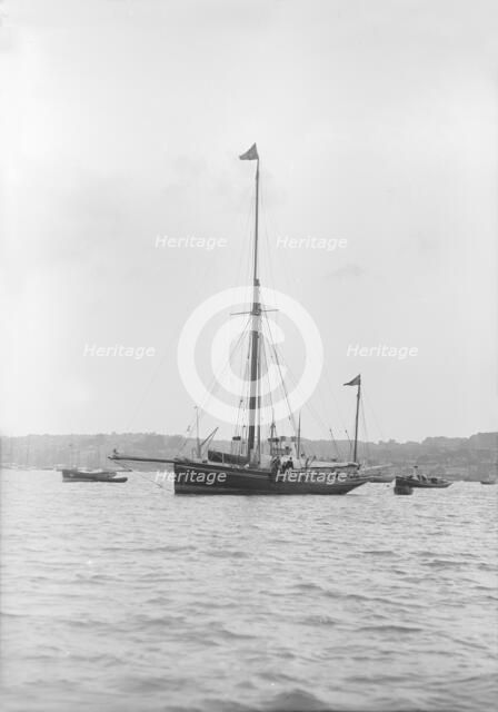 The 40 ton yawl 'Hyacinth' at anchor, 1913. Creator: Kirk & Sons of Cowes.