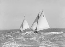 The 6 Metre Correnzia and Snowdrop heading downwind in breezy conditions, 1911. Creator: Kirk & Sons of Cowes