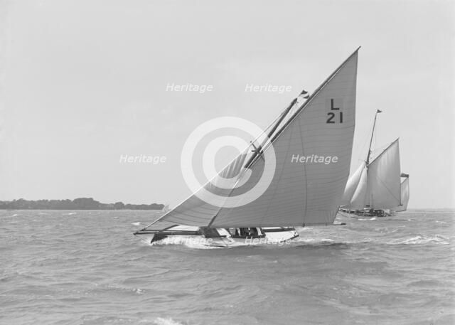 The 6 Metre 'Cheetal' (L21) sailing upwind, 1911. Creator: Kirk & Sons of Cowes.