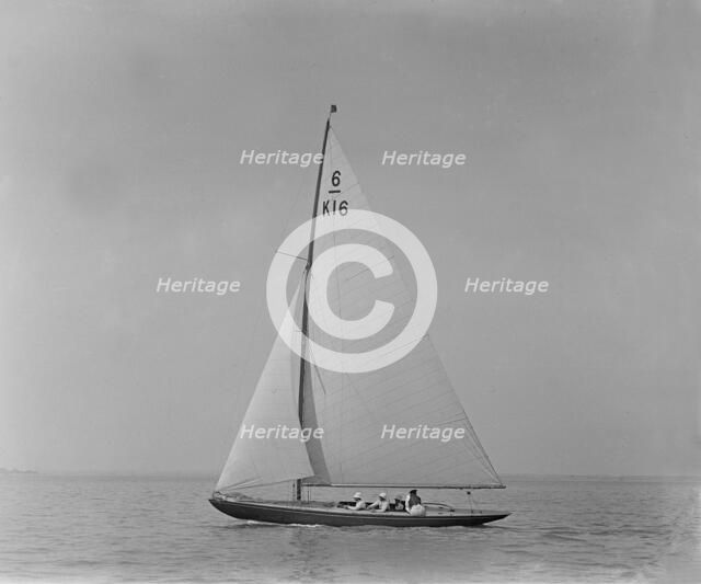The 6 Metre class boat 'Jean' (K16) sailing close-hauled, 1921. Creator: Kirk & Sons of Cowes.