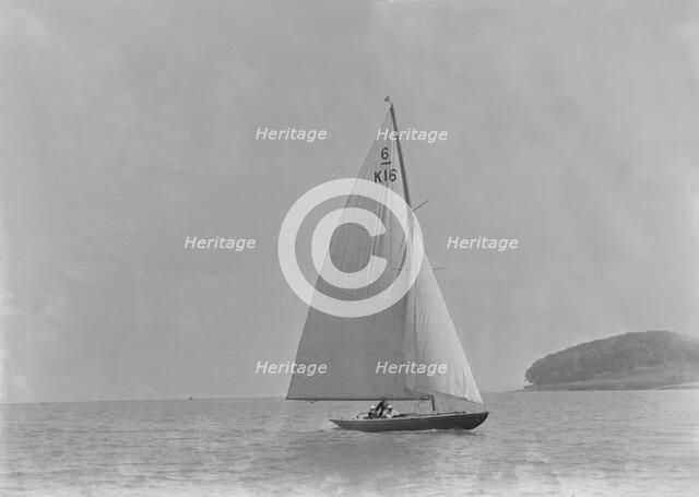 The 6 Metre class 'Jean' (K16) sailing in light winds, 1921. Creator: Kirk & Sons of Cowes.