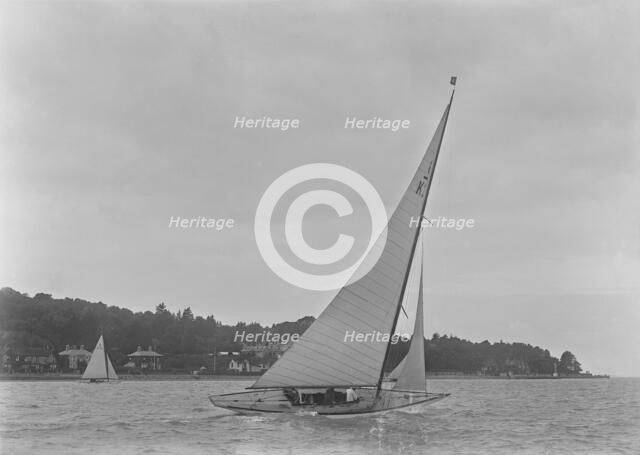 The 6 Metre class 'Maid Marion' (K22) sailing close-hauled, 1921. Creator: Kirk & Sons of Cowes.
