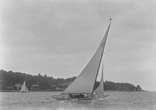 The 6 Metre class Maid Marion (K22) sailing close-hauled, 1921. Creator: Kirk & Sons of Cowes