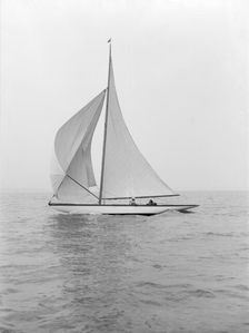 The 6 Metre class Marmi sailing under spinnaker, 1914. Creator: Kirk & Sons of Cowes
