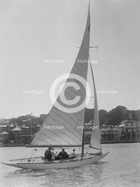 The 6 Metre class sailing yacht 'Reg', 1922. Creator: Kirk & Sons of Cowes.
