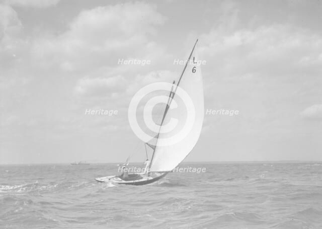 The 6 Metre class 'The Whim' (L6) sailing downwind, 1911. Creator: Kirk & Sons of Cowes.