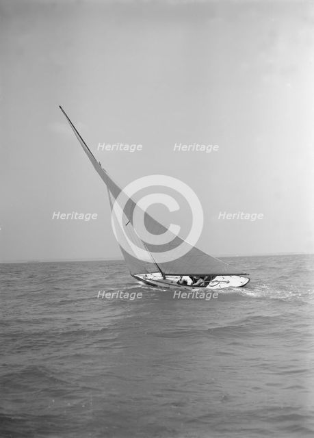 The 6 Metre class 'The Whim' sailing upwind, 1911. Creator: Kirk & Sons of Cowes.