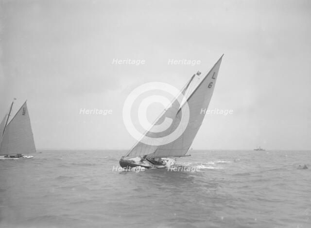 The 6 Metre Class 'The Whim' sailing close-hauled, 1911. Creator: Kirk & Sons of Cowes.