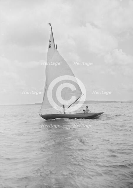 The 6 Metre Class 'The Whim' sailing downwind, 1912. Creator: Kirk & Sons of Cowes.