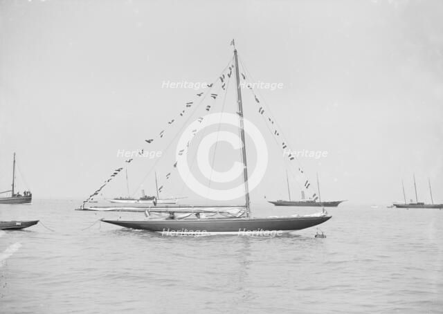 The 6 Metre 'Cremona' moored with flags, 1913. Creator: Kirk & Sons of Cowes.