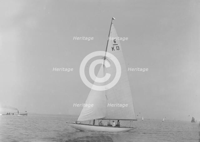 The 6 Metre 'Flya' (K13) sailing close-hauled, 1921. Creator: Kirk & Sons of Cowes.