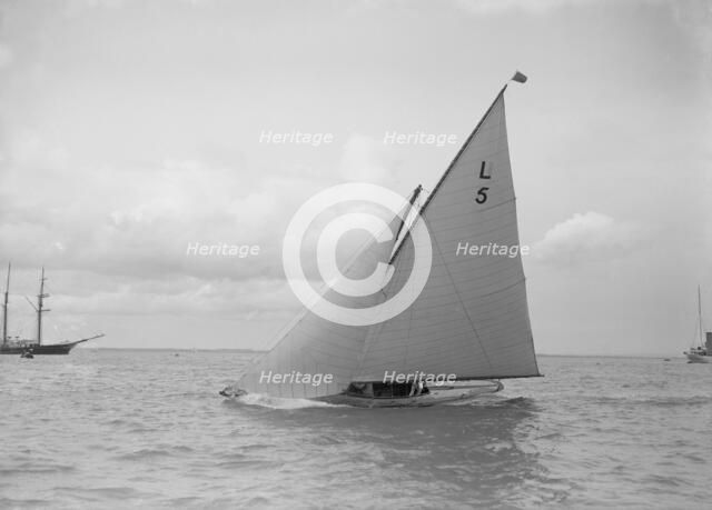 The 6 Metre 'Jonquil' sailing close-hauled, 1912. Creator: Kirk & Sons of Cowes.