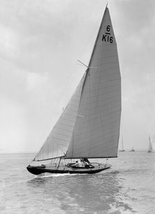 The 6 Metre Jean (K16) sailing upwind, 1922. Creator: Kirk & Sons of Cowes