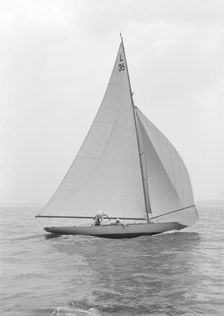 The 6 Metre Lanka sailing with spinnaker, 1914. Creator: Kirk & Sons of Cowes