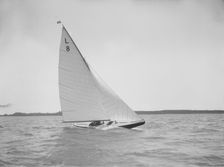 The 6 Metre Scotia IV sailing upwind on a fine day, 1913. Creator: Kirk & Sons of Cowes
