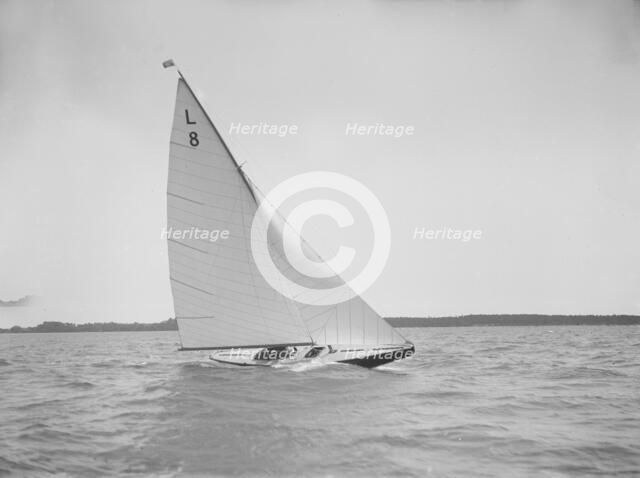 The 6 Metre 'Scotia IV' sailing upwind on a fine day, 1913. Creator: Kirk & Sons of Cowes.