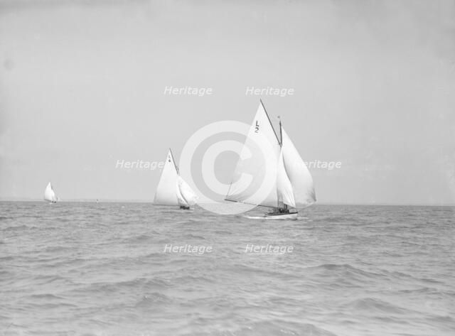 The 6 Metre 'The Whim' (L6) and 'Correnzia' racing downwind, 1911. Creator: Kirk & Sons of Cowes.