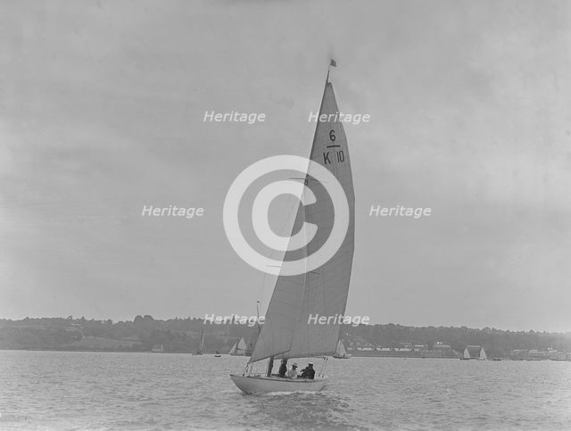 The 6 Metre yacht 'Polly' (K10) sailing upwind, 1921. Creator: Kirk & Sons of Cowes.