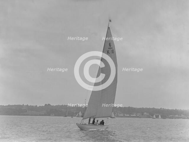 The 6 Metre yacht 'Polly' (K10) sailing upwind, 1921. Creator: Kirk & Sons of Cowes.